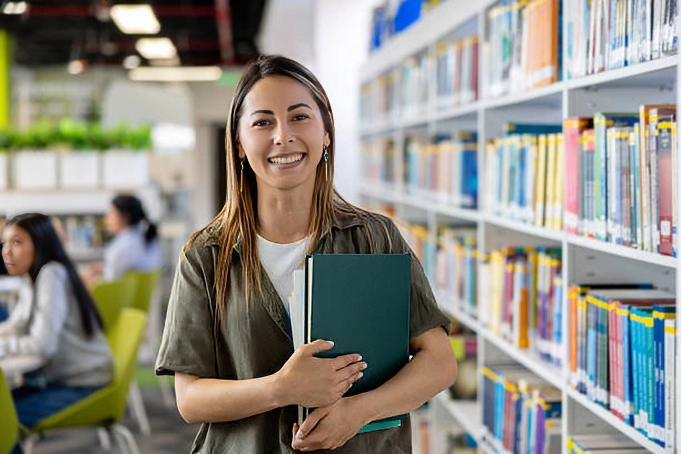 female student smiling in library