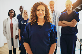 young female doctor standing out of crowd